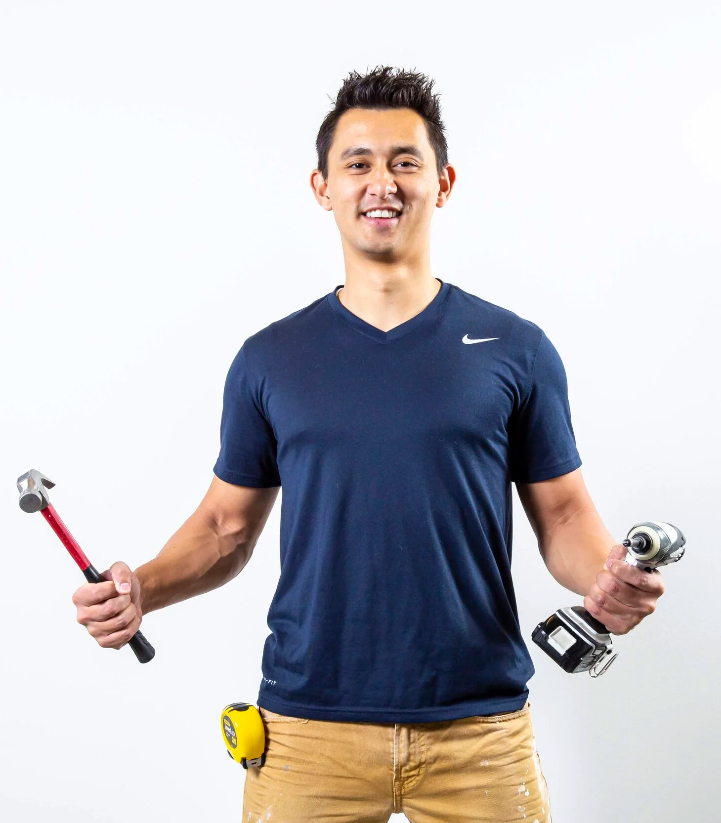 Colton Crump with drill and hammer